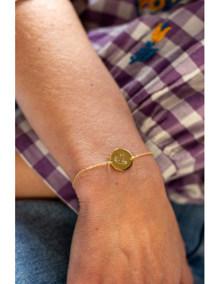 Bracelet fin en plaqué or avec médaillon rond gravé d'une colombe - Comptoir Doré