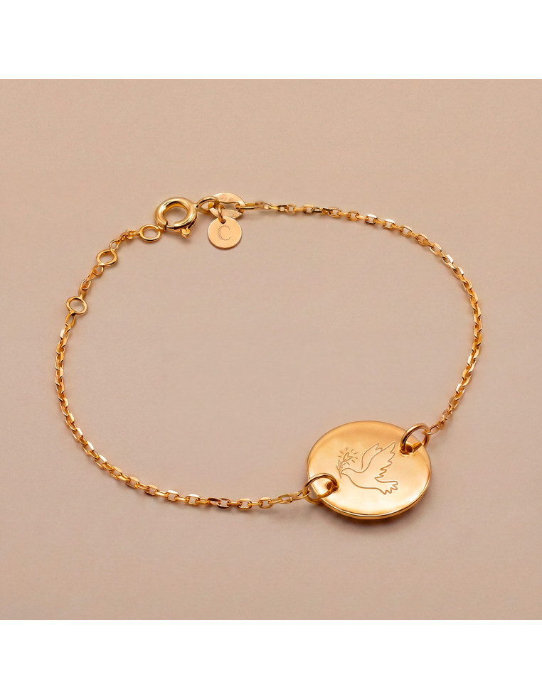 Bracelet fin en plaqué or avec médaillon rond gravé d'une colombe - Comptoir Doré